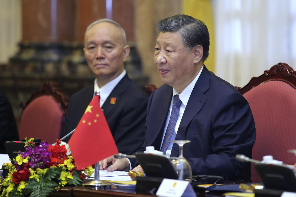 Chinese President Xi Jinping, right, speaks to Vietnamese President Vo Van Thuong, not pictured, during a meeting at the Presidential Palace in Hanoi, Vietnam, Wednesday, Dec. 13, 2023. (Luong Thai Linh/Pool Photo via AP)