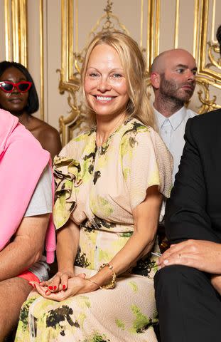 <p>SplashNews.com</p> A makeup-free Pamela Anderson also attended Victoria Beckham's show wearing pretty florals.