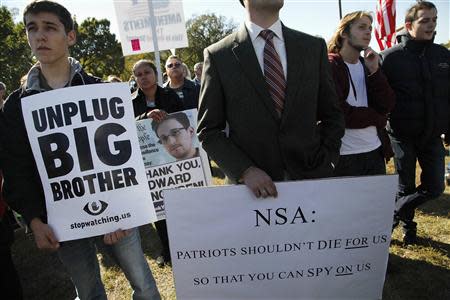 Demonstrators gather for the "Stop Watching Us: A Rally Against Mass Surveillance" near the U.S. Capitol in Washington, October 26, 2013. REUTERS/Jonathan Ernst