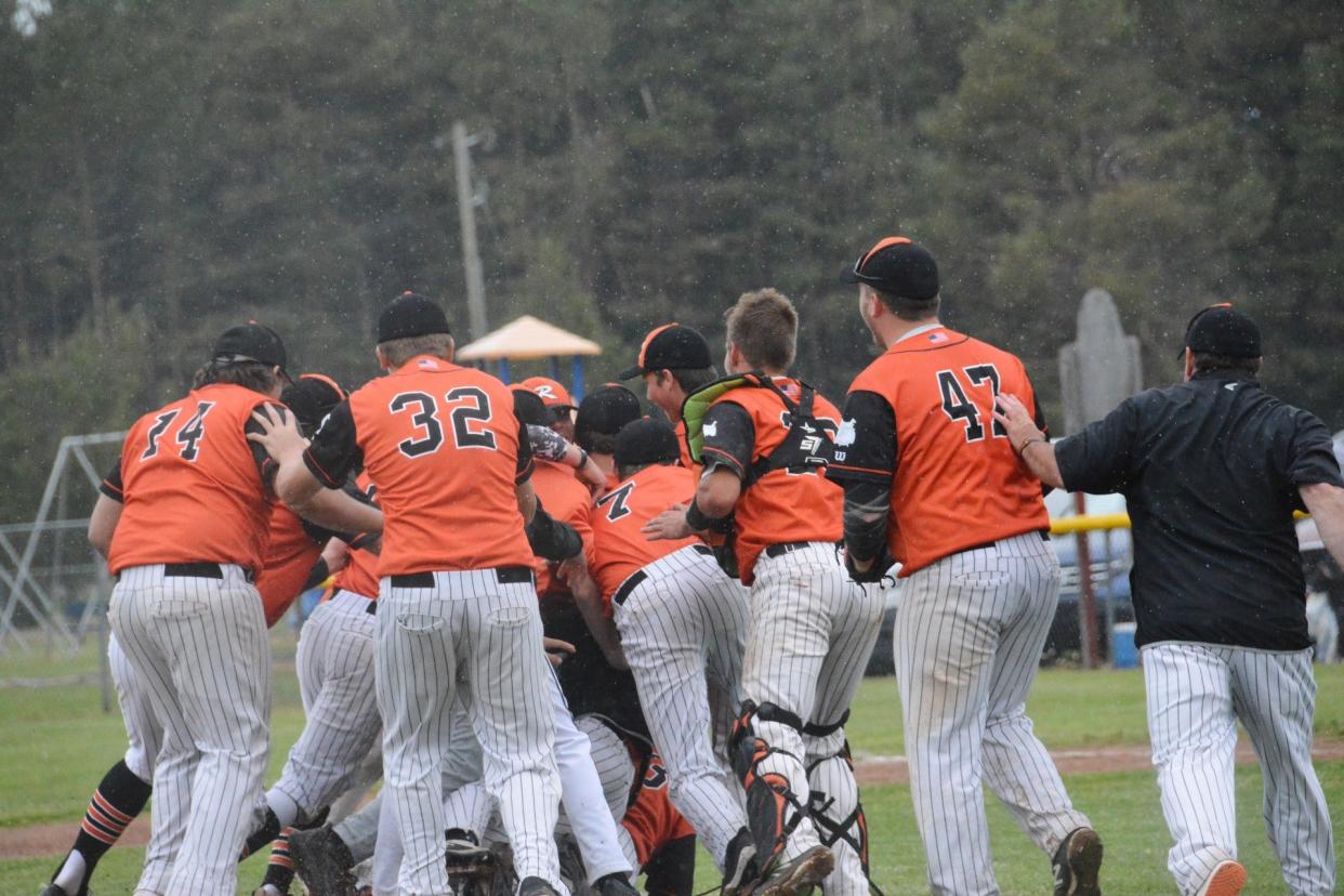 The Rudyard Bulldogs pile up in a celebration after winning a quarterfinal against Johannesburg-Lewiston Saturday. Rudyard advances to the semifinals at Michigan State Thursday.