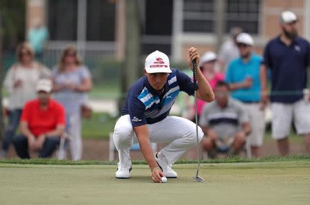 Feb 25, 2017; Palm Beach Gardens, FL, USA; Rickie Fowler prepares to putt on the second hole during the third round of The Honda Classic at PGA National (Champion). Mandatory Credit: Jason Getz-USA TODAY Sports