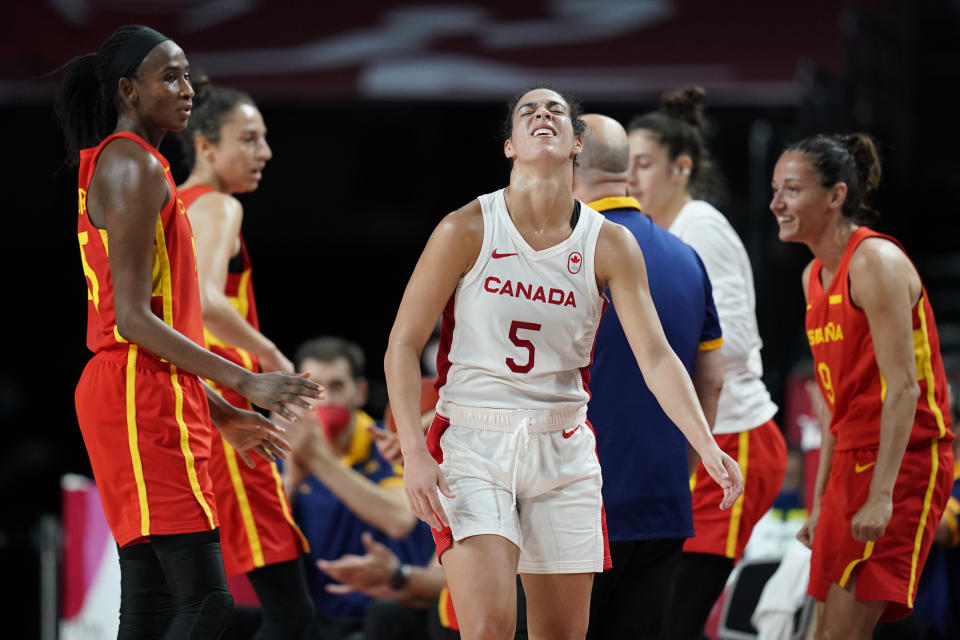 Canada's Kia Nurse (5), center, reacts after losing the ball during women's basketball preliminary round game against Spain at the 2020 Summer Olympics, Sunday, Aug. 1, 2021, in Saitama, Japan. (AP Photo/Charlie Neibergall)