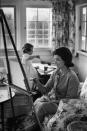 <p>The future First Lady and her daughter, Caroline, enjoy an afternoon of painting from their living room in 1960.</p>