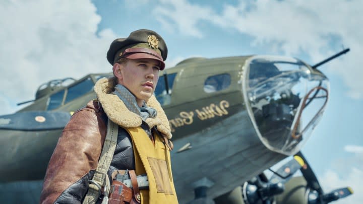 Austin Butler stands next to a plane in Masters of the Air.