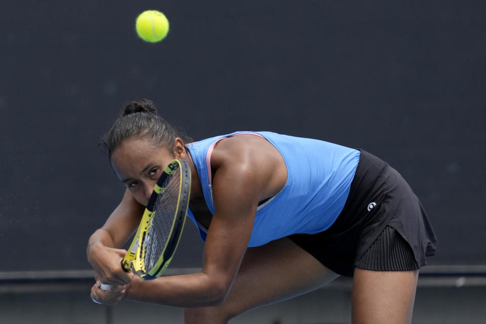 Leylah Fernandez of Canada plays a backhand return to Maddison Inglis of Australia during their first round match at the Australian Open tennis championships in Melbourne, Australia, Tuesday, Jan. 18, 2022. (AP Photo/Simon Baker)