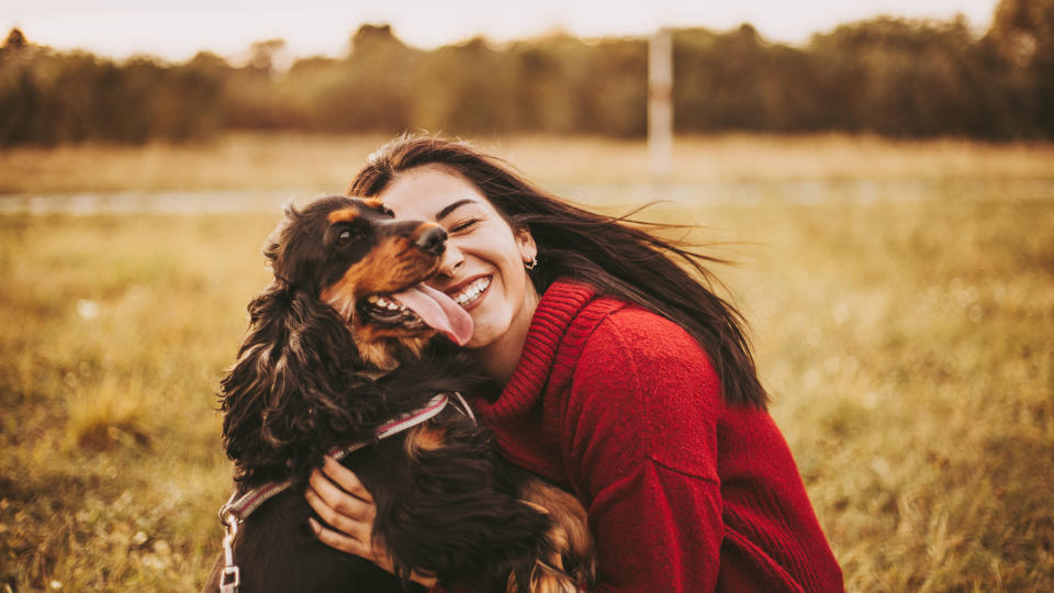 girl hugging her dog