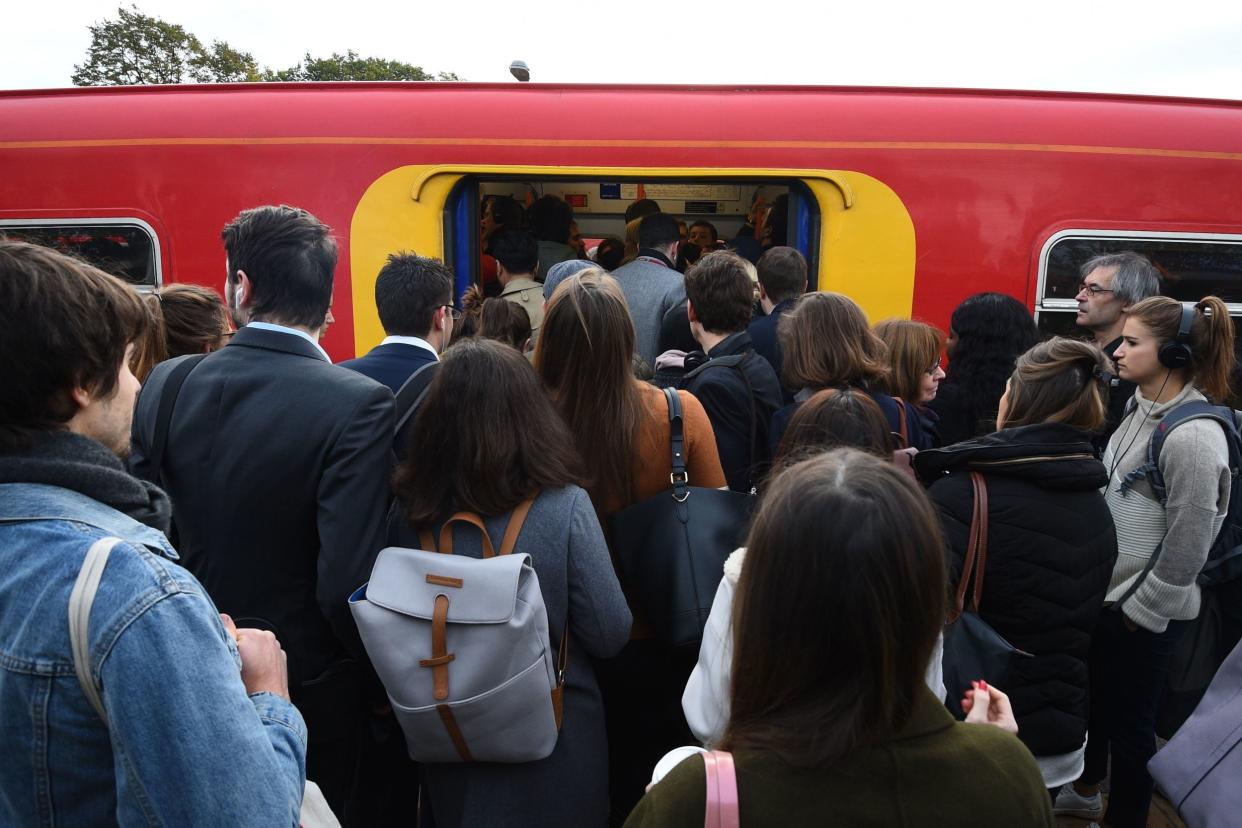 Delays: commuters board a South Western service: PA