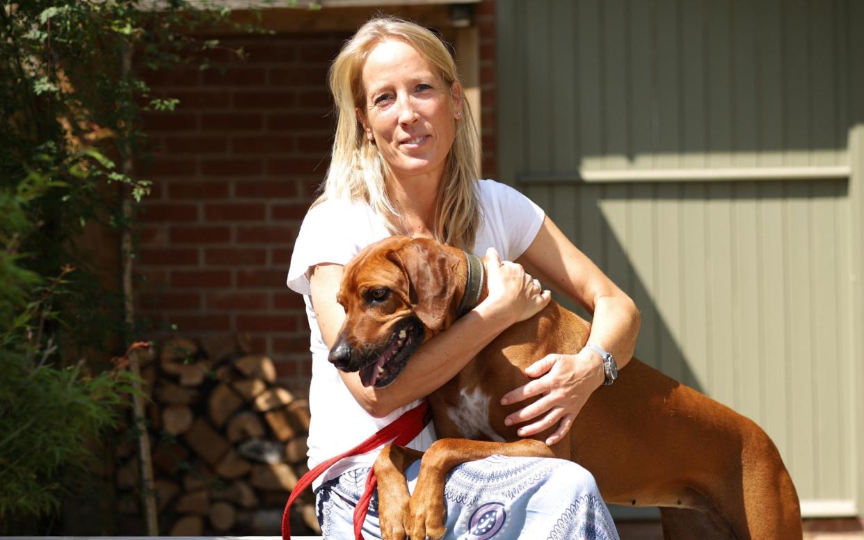 Abigail Butcher photographed with her dog Thala at their home in Lymington, Hampshire. - John Lawrence