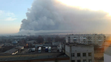 Smoke rises over a warehouse storing tank ammunition at a military base in the town of Balaklia (Balakleya), Kharkiv region, Ukraine, March 23, 2017. State Emergency Service of Ukraine/Handout via REUTERS