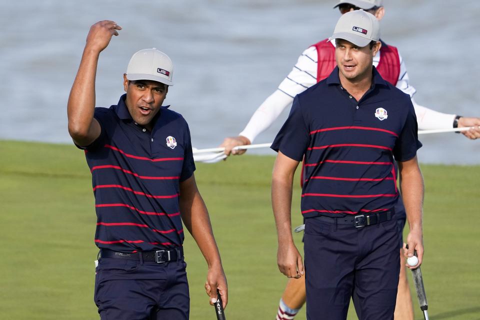 Team USA's Tony Finau reacts after making a putt on the 13th hole during a four-ball match the Ryder Cup at the Whistling Straits Golf Course Friday, Sept. 24, 2021, in Sheboygan, Wis. (AP Photo/Jeff Roberson)