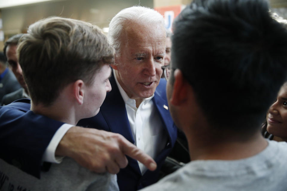 Former Vice President and Democratic presidential candidate Joe Biden meets with attendees at a campaign event Saturday, Jan. 11, 2020, in Las Vegas. (AP Photo/John Locher)