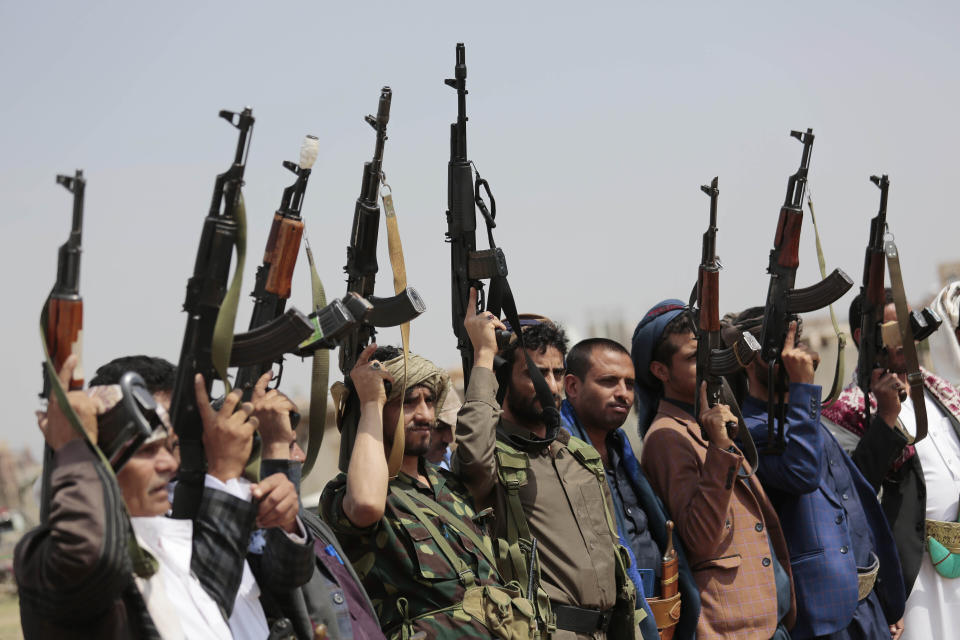 FILE - In this Aug. 22, 2020 file photo, tribesmen loyal to Houthi rebels raise their weapons during a protest against the agreement to establish diplomatic relations between Israel and the United Arab Emirates, in Sanaa, Yemen. Saudi Arabia announced a plan Monday, March 22, 2021, to offer Yemen's Houthi rebels a cease-fire in the country's yearslong war and allow a major airport to reopen in its capital, the kingdom's latest attempt to halt fighting that has sparked the world's worst humanitarian crisis in the Arab world's poorest nation. (AP Photo/Hani Mohammed, File)