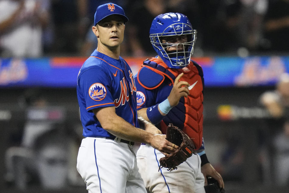 New York Mets relief pitcher David Robertson, left, talks to catcher Francisco Alvarez after a baseball game against the Chicago White Sox Tuesday, July 18, 2023, in New York. The Mets won 11-10. (AP Photo/Frank Franklin II)