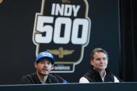 NASCAR's Kyle Larson, left, announces that he will drive for Arrow McLaren in the 2024 Indy 500 during a press conference at Indianapolis Motor Speedway in Indianapolis, Thursday, May 18, 2023. Larson was joined by Jeff Gordon, vice chairman of Hendrick Motorsport, for the announcement. (AP Photo/Michael Conroy)