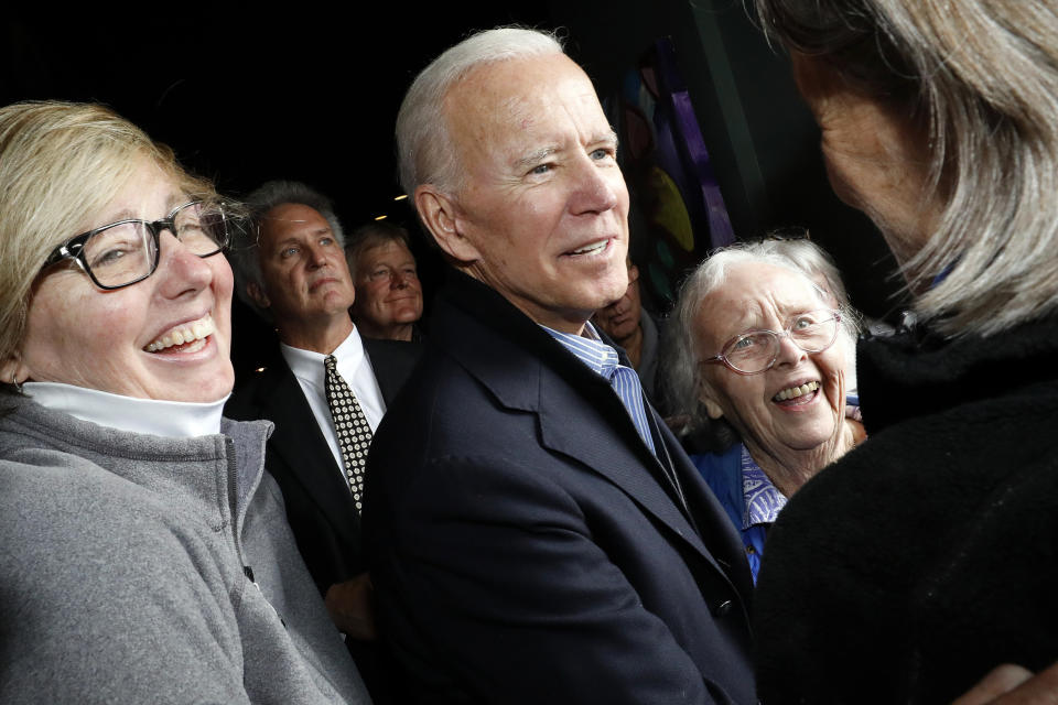 Former vice president and Democratic presidential candidate Joe Biden greets supporters during a campaign stop at the Community Oven restaurant in Hampton, N.H., Monday, May 13, 2019. (AP Photo/Michael Dwyer)