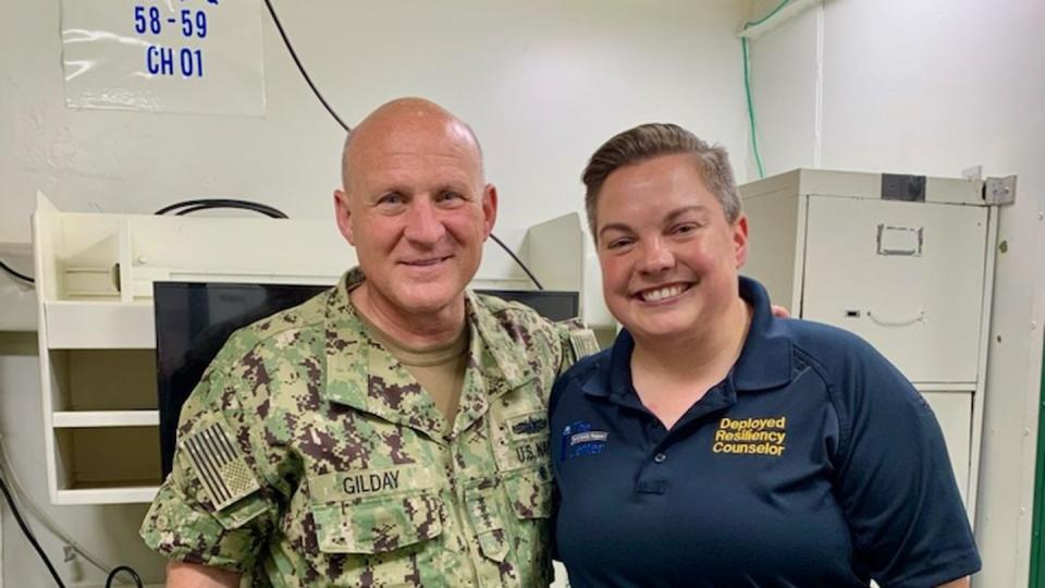 Deployed resiliency counselor Miriam Lau is visited by Chief of Naval Operations Adm. Mike Gilday while she was deployed aboard the aircraft carrier Carl Vinson. (Photo courtesy Andrew Mauldin)