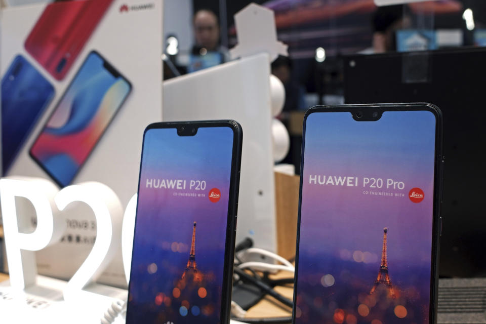 Huawei's mobile phones are displayed at a telecoms service shop in Hong Kong, Friday, March 29, 2019. Chinese tech giant Huawei's deputy chairman defended its commitment to security Friday after a stinging British government report added to Western pressure on the company by accusing it of failing to repair dangerous flaws in its telecom technology. (AP Photo/Kin Cheung)