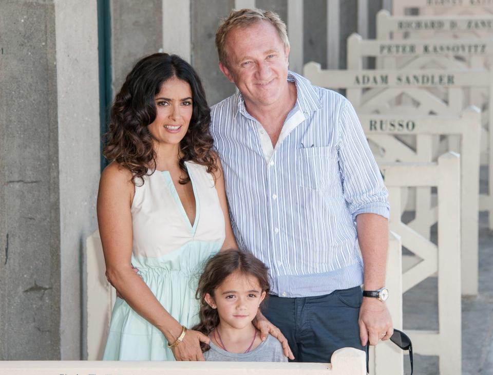 Salma and François-Henri pose with a tiny Valentina