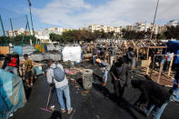 African migrants build a makeshift house after their houses burned, on the outskirts of Casablanca, Morocco October 29, 2018. REUTERS/Youssef Boudlal