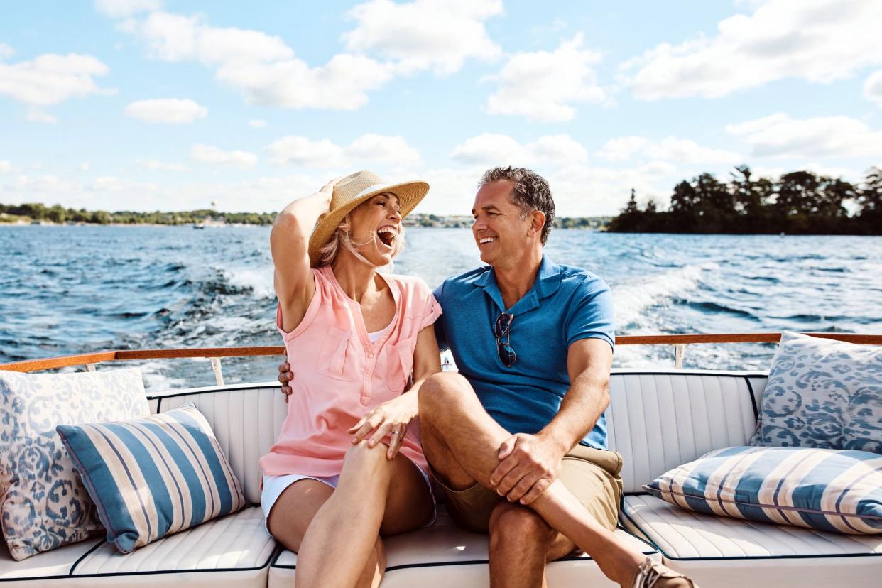 mature couple smiling on boat