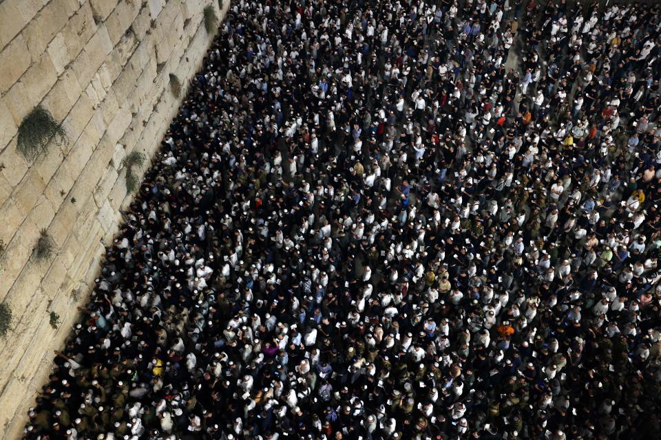 October 3, 2022: Religious Jews participate in the Slichot prayer at the Western Wall in the old city of Jerusalem before Yom Kippur.