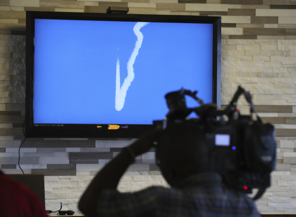 CHANGES LOCATION OF EDWARDS AIR FORCE BASE - In this April 17, 2018 photo, a NASA image of a F/A-18 performing a Sonic Boom over Edwards Air Force Base in California, is shown on a TV screen in Galveston, Texas. NASA has begun a series of supersonic research flights off the Texas Gulf Coast near Galveston to test how the community responds to noise from a new experimental aircraft. (Steve Gonzales/Houston Chronicle via AP)