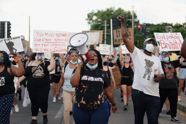 Michael B. Thomas/Getty Then-congressional candidate Cori Bush leads a Black Lives Matter protest in University City, Mo., in June 2020