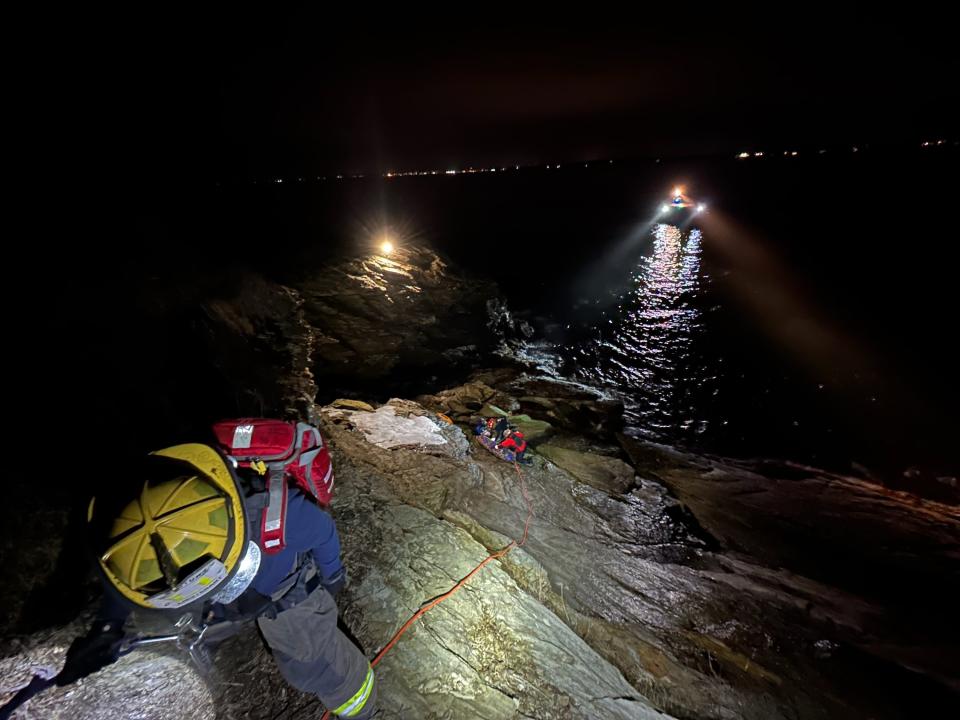 Jamestown firefighters tend to an injured person during a drone-assisted search and rescue at Beavertail State Park on Feb. 9.