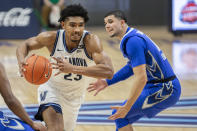 Creighton forward Damien Jefferson (23) moves past Creighton guard Marcus Zegarowski (11) during the first half of an NCAA college basketball game Wednesday, March 3, 2021, in Villanova, Pa. (AP Photo/Laurence Kesterson)