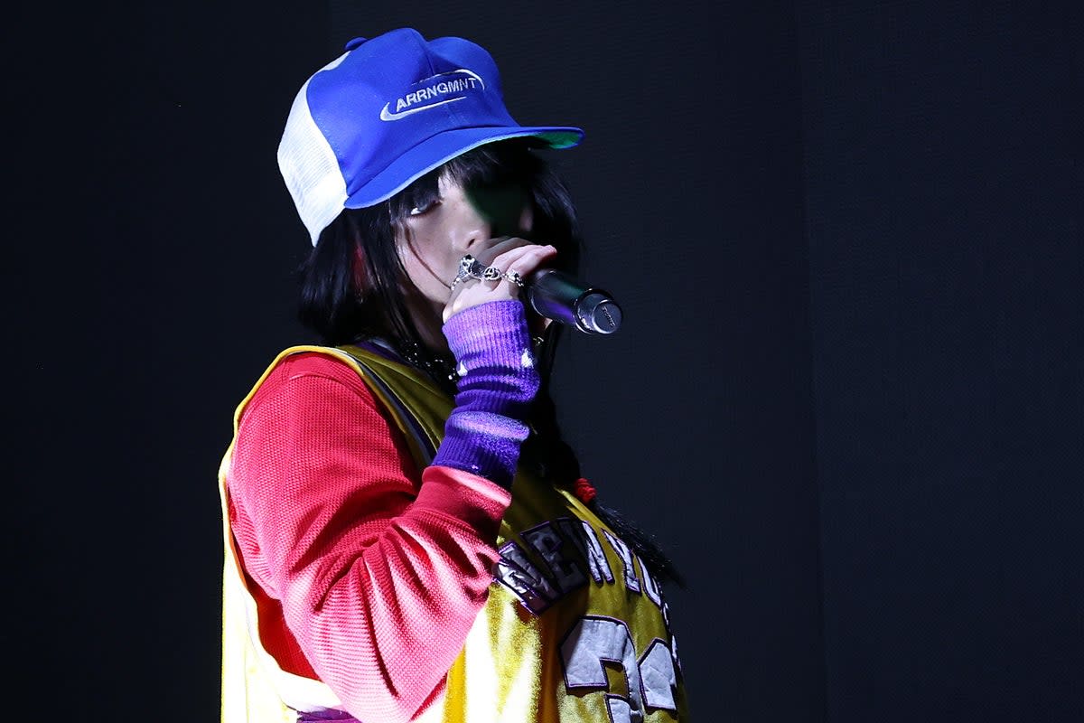 Dressed in bright baseball garb, Billie Eilish performs at this year’s Reading Festival  (Getty)