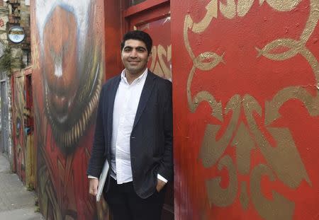 British-Iranian Ali Tehrani, a 24-year-old University College of London graduate and founder of start-up firm KeyPursuit poses for a photograph at a cafe in London, Britain, in this picture taken March 22, 2016. REUTERS/Pamela Barbaglia