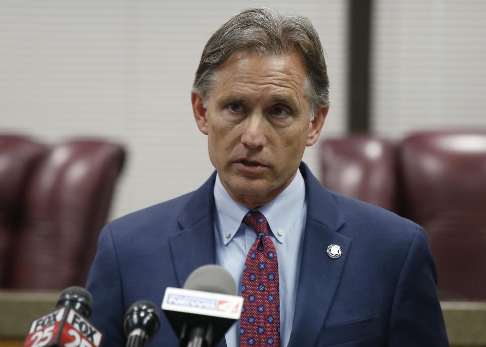 Oklahoma Attorney General Mike Hunter speaks to the media at a news conference following closing arguments in Oklahoma's ongoing opioid drug lawsuit against Johnson & Johnson Monday, July 15, 2019, in Norman, Okla. (AP Photo/Sue Ogrocki)