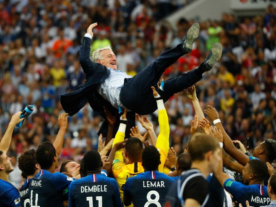 France players celebrate winning the World Cup with coach Didier Deschamps (REUTERS)