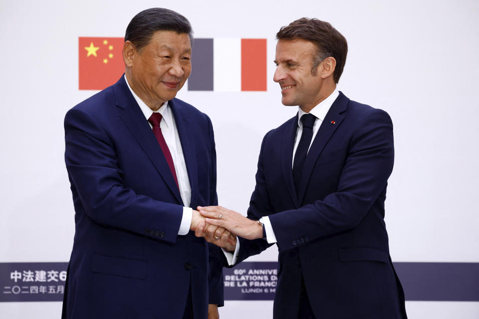 China's President Xi Jinping, left, and French President Emmanuel Macron shake hands after a joint statement at the Elysee Palace in Paris as part of the Chinese president's two-day state visit in France, Monday, May 6, 2024. French President Emmanuel Macron put trade disputes and Ukraine-related diplomatic efforts on top of the agenda for talks Monday with Chinese President Xi Jinping, who arrived in France for a two-day state visit opening his European tour. (Sarah Meyssonnier/Pool via AP)