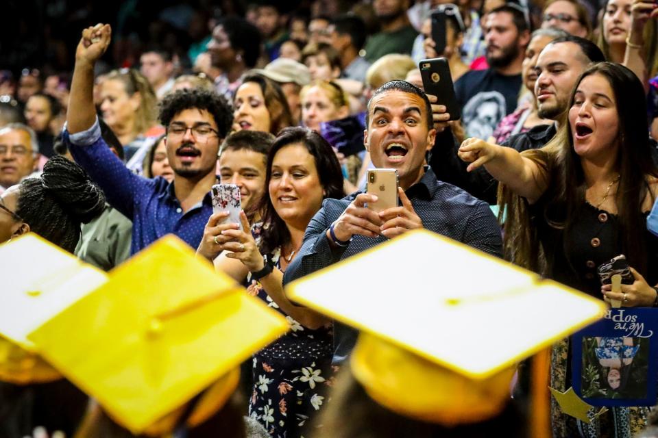 Family and friends cheer for their graduates as they enter the arena during the Lehigh Senior High School graduation ceremony at Alico Arena in Estero last May. This year's seniors and their parents worry they won't get to enjoy the experience because of coronavirus closures.