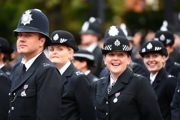 Metropolitan police officers are seen walking in formation down The Mall ahead of State Funeral of Queen Elizabeth II on September 19, 2022, in London.