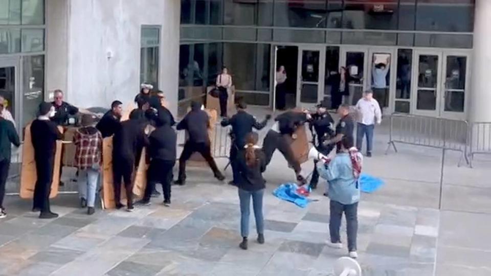 A still photo from a video shows the moment protesters and law enforcement clashed in front of the Cal Poly Rec Center on Jan. 23, 2024. A small group of people involved in a pro-Palestine protest reportedly attempted to breaking into the building where a winter career fair was being hosted.