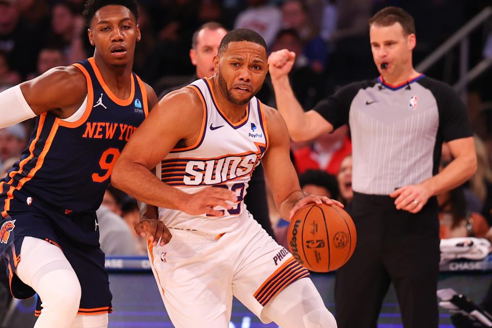 Eric Gordon #23 of the Phoenix Suns drives past R.J Barret #9 of the New York Knicks during the first half at Madison Square Garden on Nov. 26, 2023, in New York City, New York.