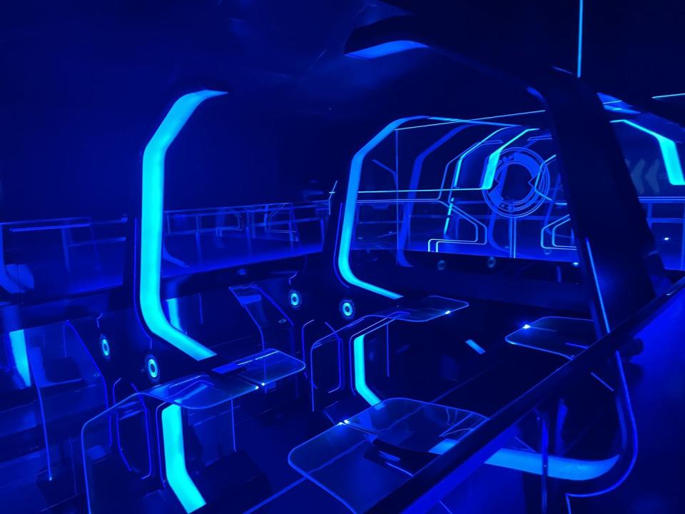 tron light cycle run at walt disney world inside the launch area of the ride