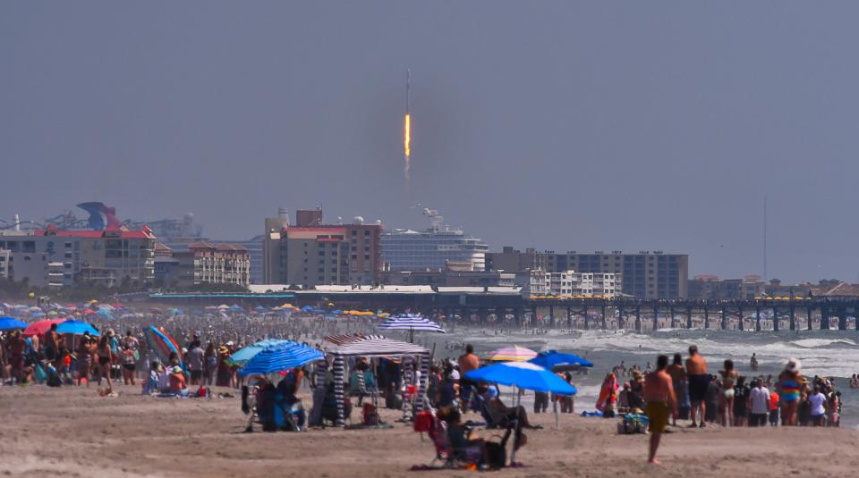 As cruise ships head out of Port Canaveral 4th of July crowds on the beach in Cocoa Beach watch the launch of a SpaceX Falcon 9 rocket for the European Space Agency with the Euclid space telescope. Launched from Launch Complex 40 at Cape Canaveral Space Force Station at 11:12 E DT Saturday July 1st. 