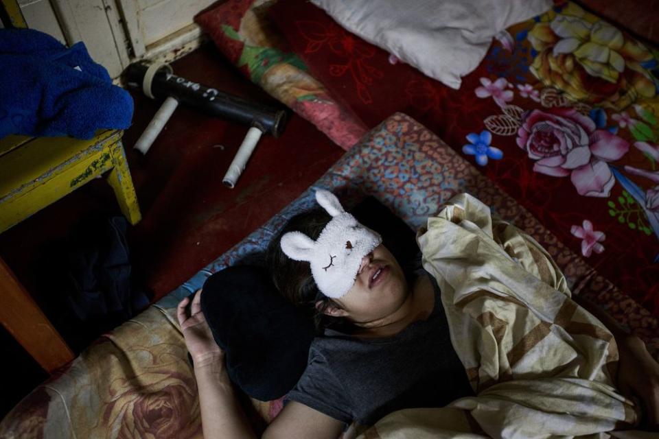 A student sleeps beside her handmade weapon in the National Autonomous University of Managua on June 29.