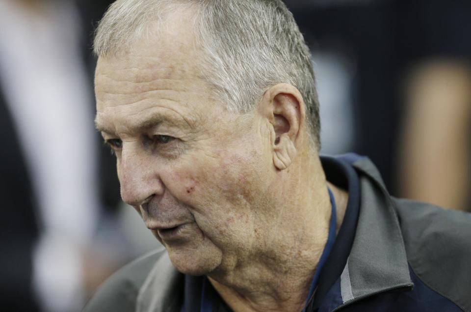 Former Connecticut head coach Jim Calhoun is interviewed by members of the media during the team's practice for their NCAA Final Four tournament college basketball semifinal game Friday, April 4, 2014, in Dallas. Connecticut plays Florida on Saturday, April 5, 2014. (AP Photo/Charlie Neibergall)