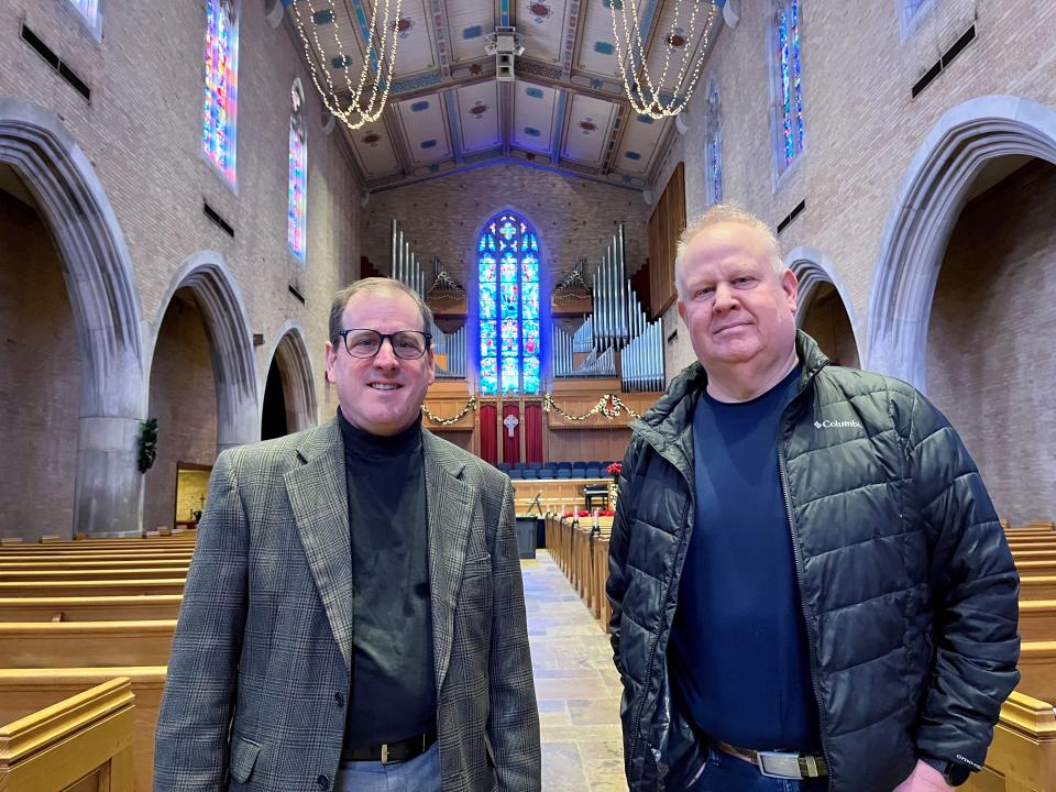 Pastor Dr. R. Courtney Krueger, left, and music director Gerald Peel stand inside First Cumberland Presbyterian Church in Chattanooga on Dec. 14. The church was designed by BarberMcMurry of Knoxville.