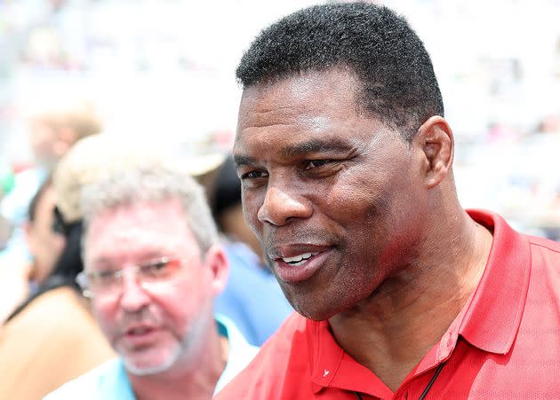 Herschel Walker, Republican candidate for U.S. Senate in Georgia, walks off-stage during pre-race ceremonies at a NASCAR event in Hampton, Georgia, on Sunday. (Photo: James Gilbert via Getty Images)