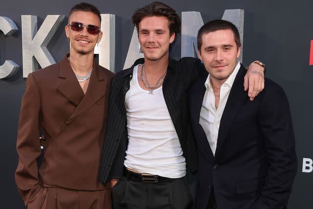 <p>Mike Marsland/WireImage</p> Romeo, Cruz and Brooklyn Beckham at the 'Beckham' premiere