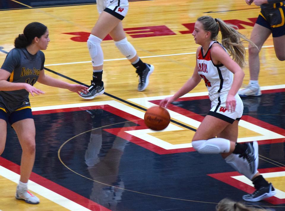 Katie Fox pushes the ball up the court for Lakota West during the Firebirds romp past Toledo Notre Dame.