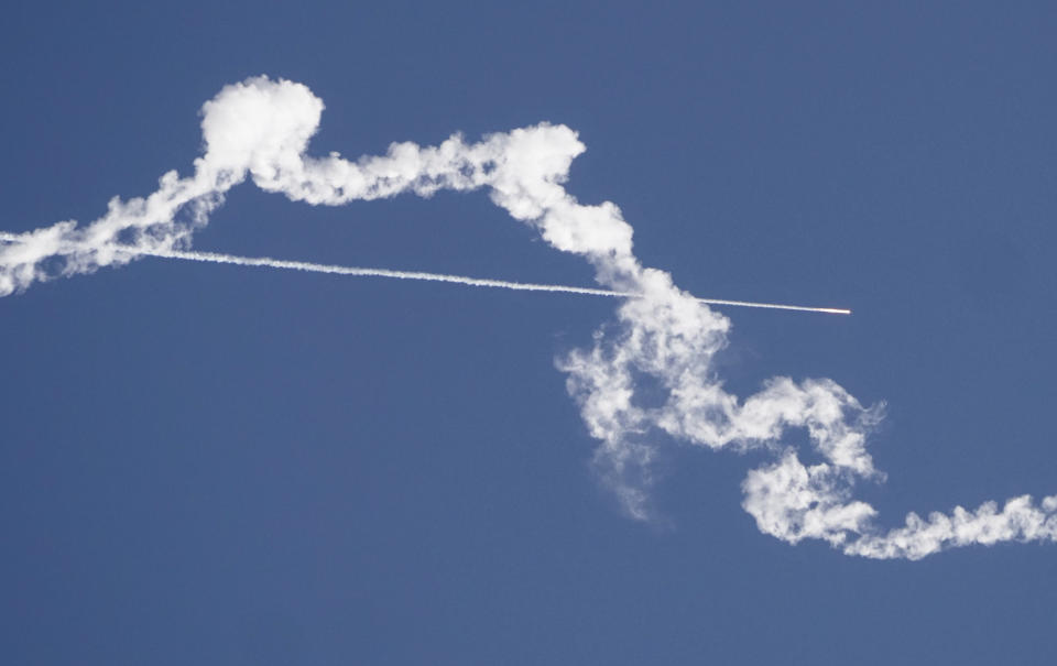 In this Sunday, Nov. 8, 2020, file photo, a missile launched by the Armenian forces flies over Nagorno-Karabakh. The General Staff on Thursday, Feb. 25, 2021 issued a statement calling for the resignation of Prime Minister Nikol Pashinyan, which was signed by top military officers. The move was triggered by Pashinyan’s decision earlier this week to oust the first deputy chief of the General Staff. Pashinyan after he derided the prime minister's claim that just 10% of Russia-supplied Iskander missiles that Armenia used in the conflict exploded on impact. (AP Photo/Dmitri Lovetsky, File)