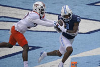 North Carolina wide receiver Dyami Brown (2) scores a touchdown as Virginia Tech defensive back Armani Chatman (27) chases during the first half of an NCAA college football game in Chapel Hill, N.C., Saturday, Oct. 10, 2020. (AP Photo/Gerry Broome)