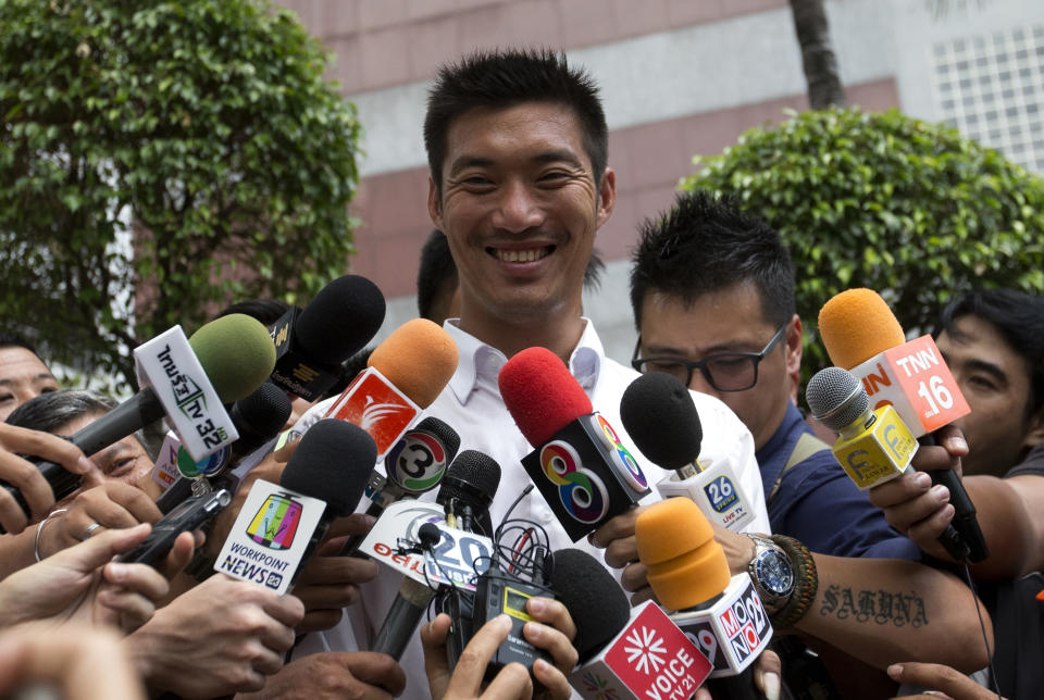 Thailand's Future Forward Party leader Thanathorn Juangroongruangkit talks to media before on vehicle to thank people who came out to vote Bangkok, Thailand, Wednesday, April 3, 2019. Thailand's ruling junta has filed a complaint accusing Thanathorn of sedition and aiding criminals. The Future Forward Party ran a strong third in the elections last month that were also contested by a pro-military party. (AP Photo/Sakchai Lalit)