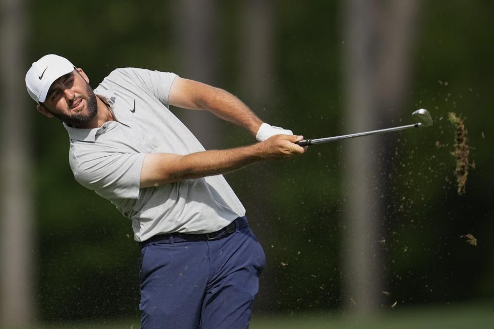 Scottie Scheffler watches his tee shot on the 12th hole during the first round at the Masters golf tournament at Augusta National Golf Club Thursday, April 11, 2024, in Augusta, Ga. (AP Photo/George Walker IV)